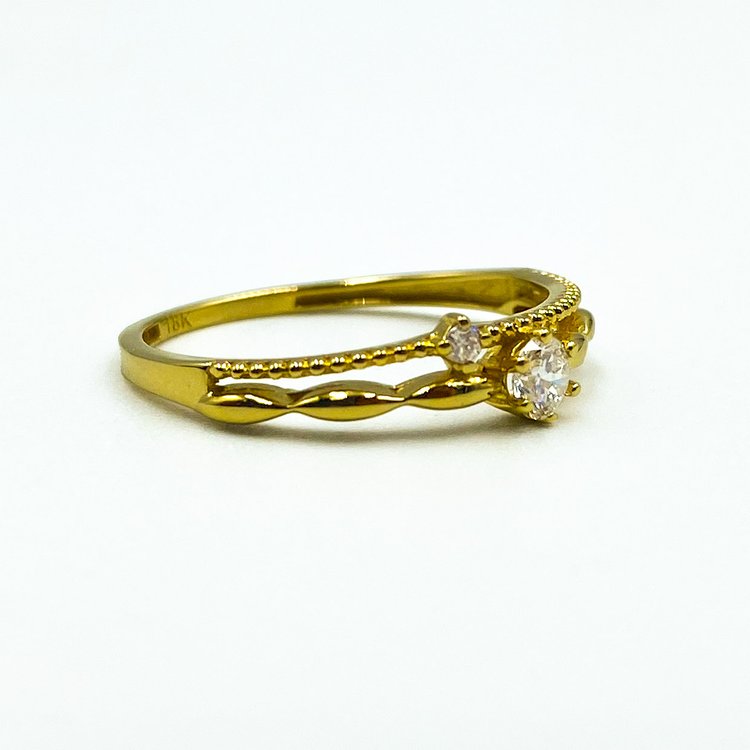 Élégance étincelante : Bague diamant en or jaune 18 carats